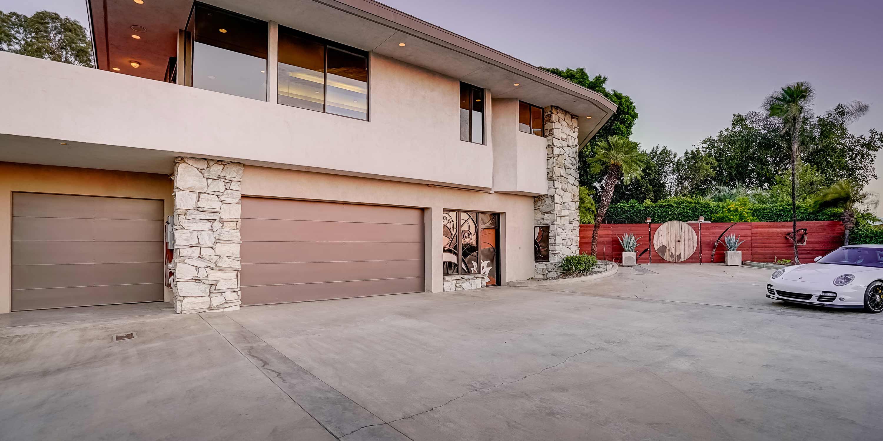 stucco home with large driveway