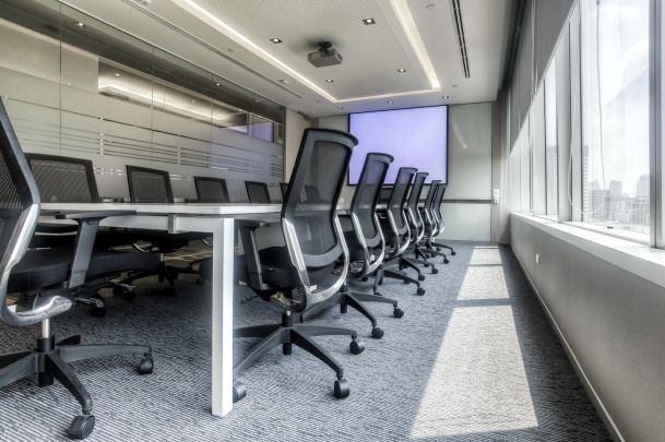 conference room with rolling chairs and presentation technology