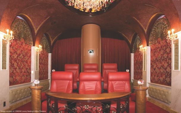 home theater with red seating and walls