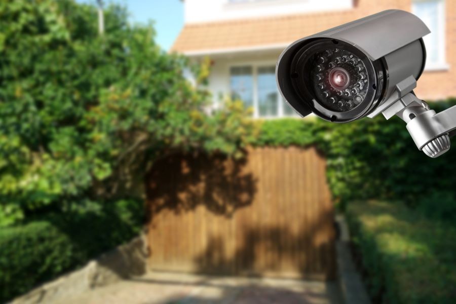 A security camera overlooking a home’s outdoor area.