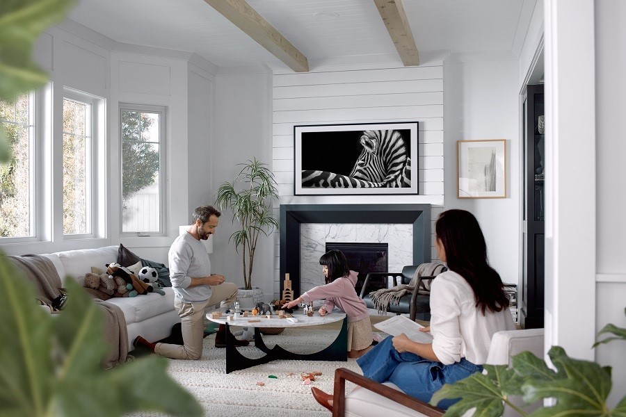 A living room featuring a Screen Acoustics StealthCover Art hiding a TV screen.
