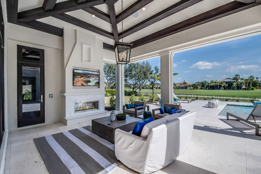 Beautiful outdoor entertainment space with a living room and an outdoor television.