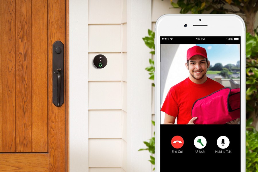 Close-up image of a video doorbell and a smartphone interface showing a delivery person 
