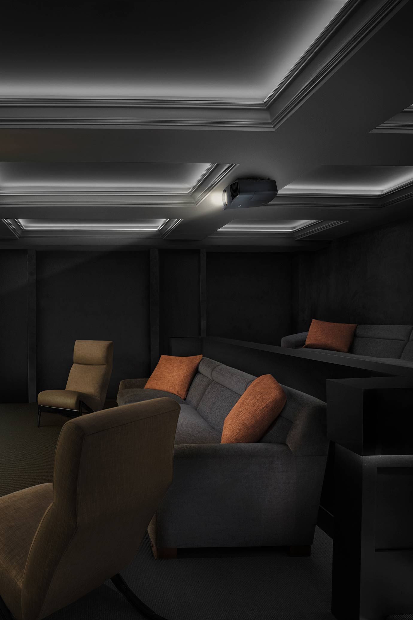 LED lighting in the ceiling of a home theater with dark walls and seating