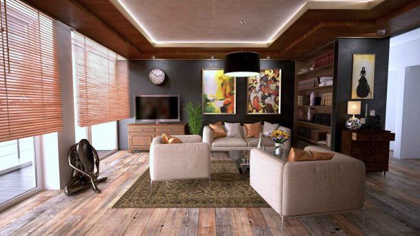 Living room with wooden floors and red accents